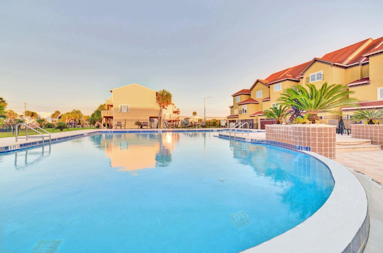 Lounge by one of two outdoor swimming pools