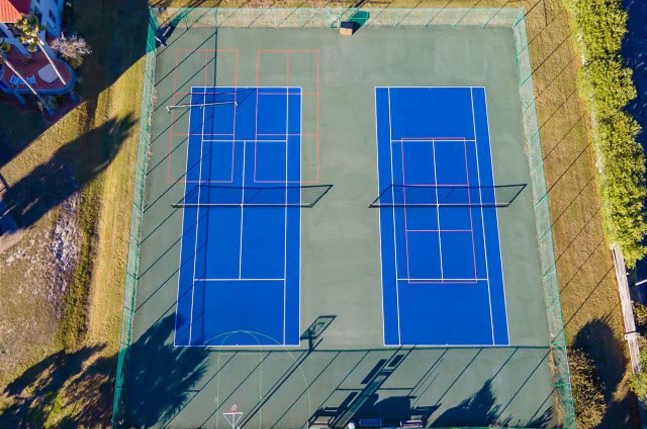 Aerial view of the complexs tennis and basketball courts.