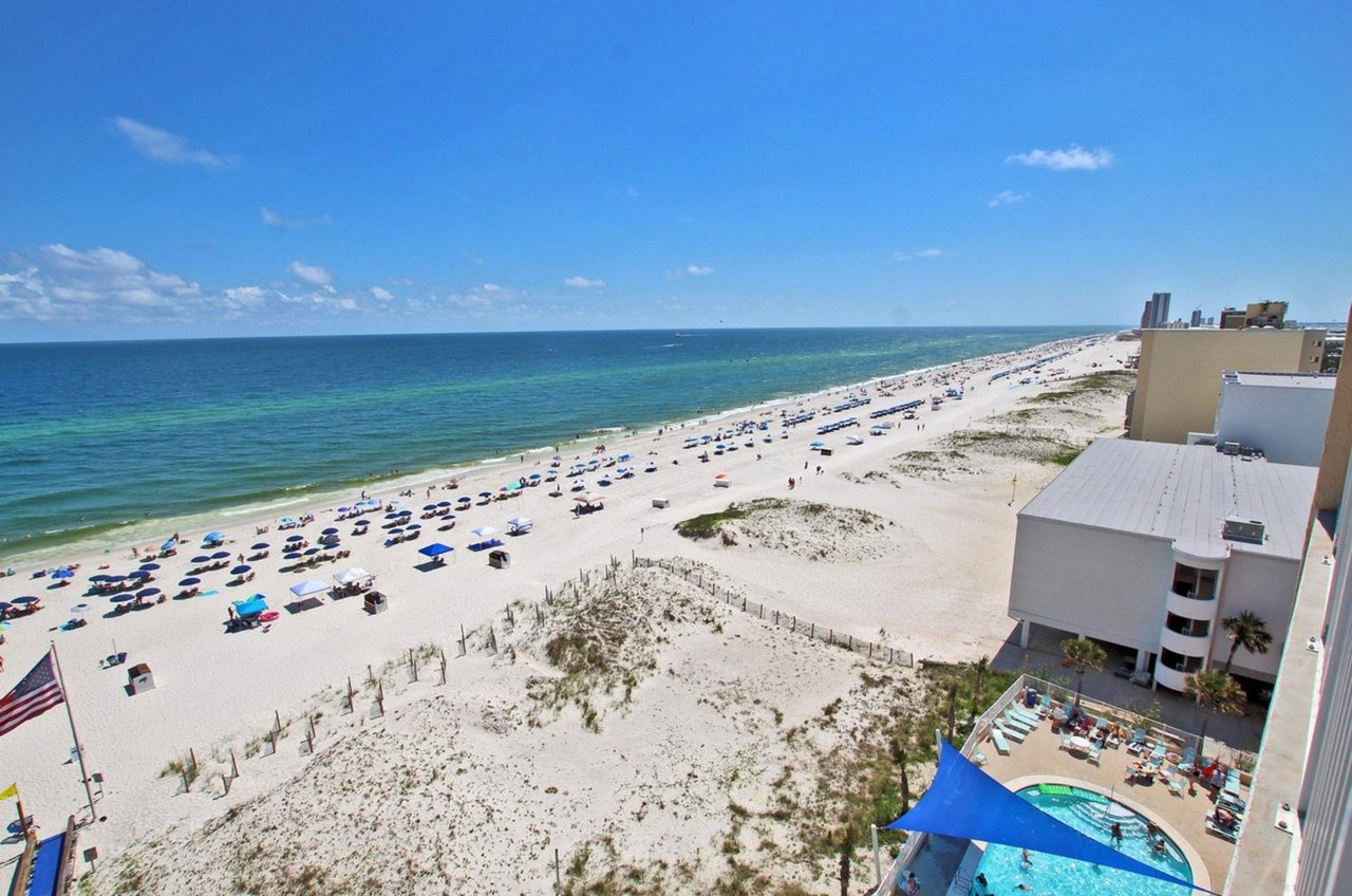 A view of the expansive beach from a balcony at San Carlos Gulf Shores