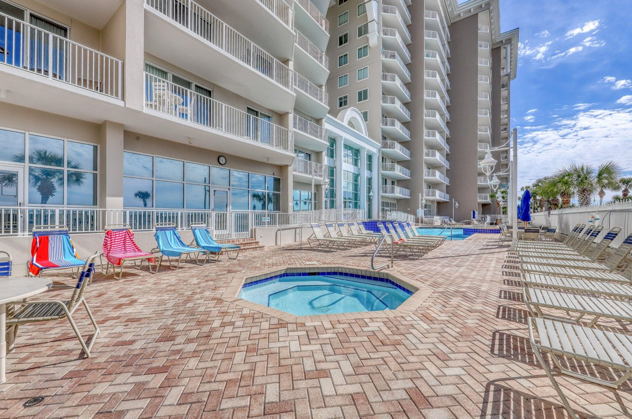 Majestic Sun balconies overlook the community pool and hot tub