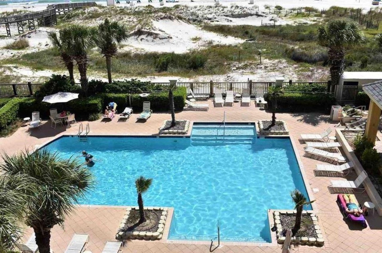 Aerial view of an outdoor pool and deck at Beach Club