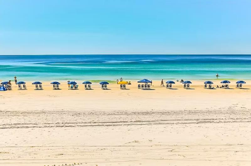 Beach chairs and umbrellas along Mediterraneas beach