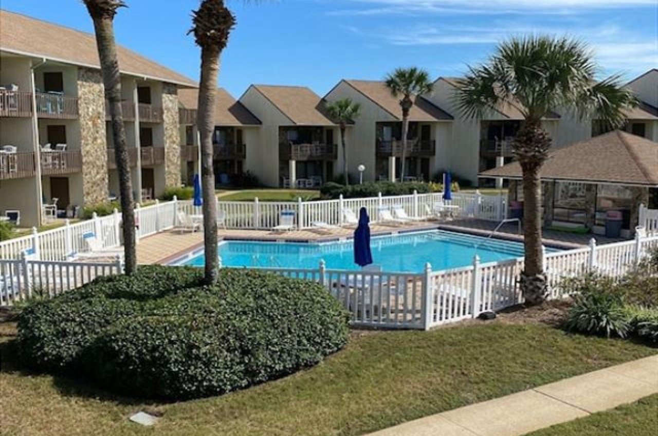 Condo balconies look out over the swimming pool.