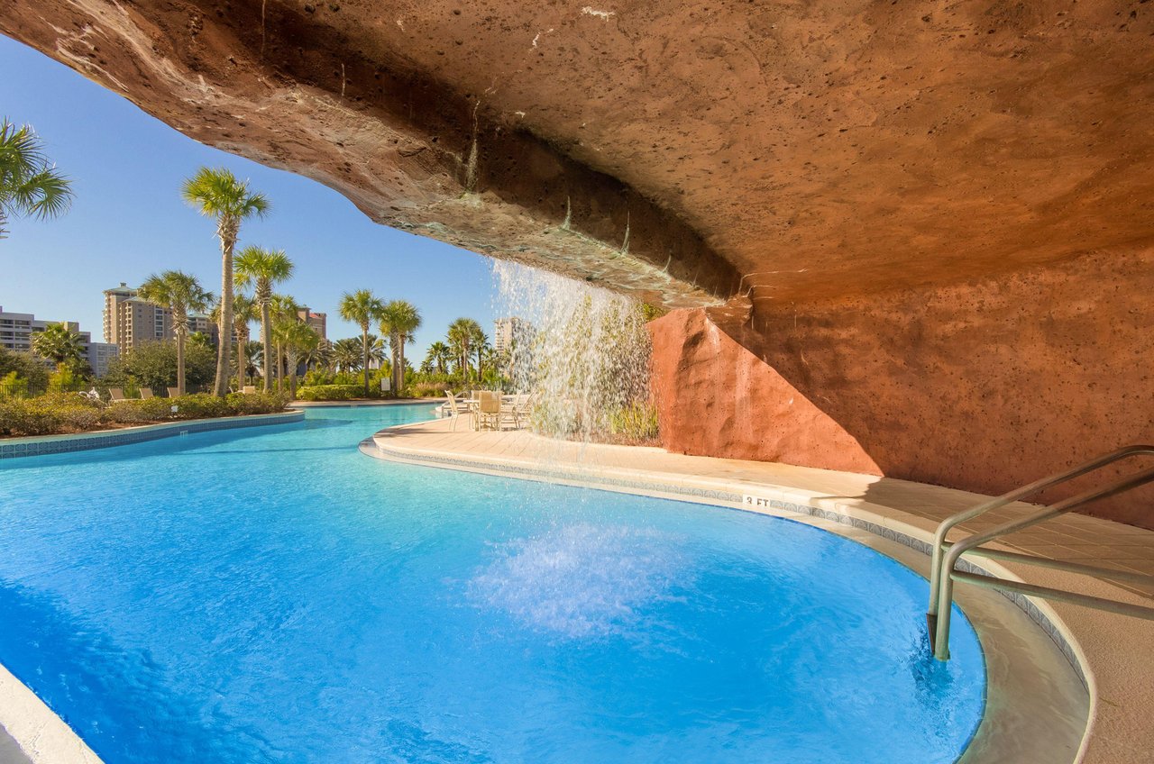 One end of the lagoon pool winds up in a cavelike structure with a waterfall cascading over the entrance