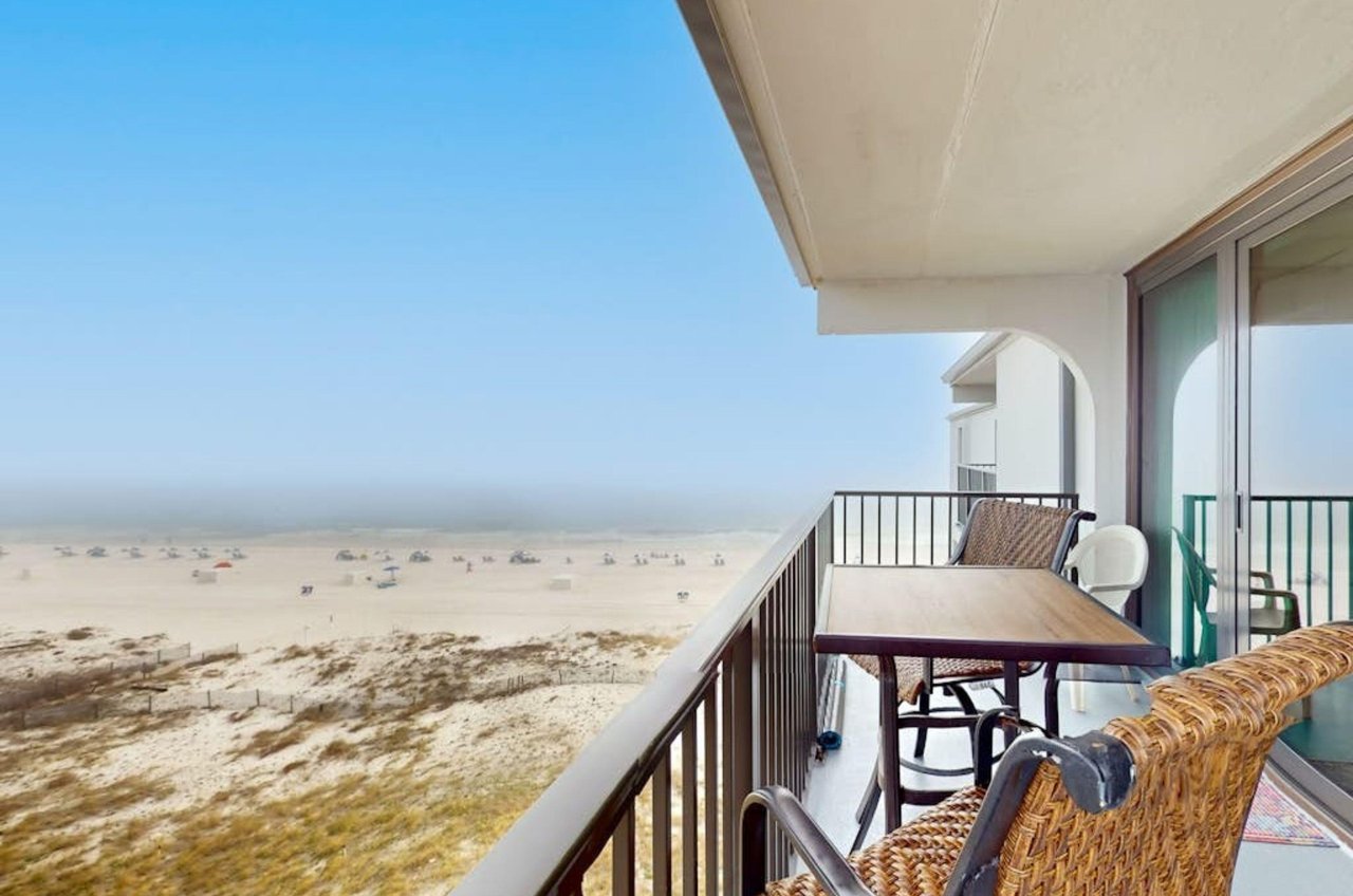 A private balcony with a lounge chair at Island Sunrise at Gulf Shores Alabama