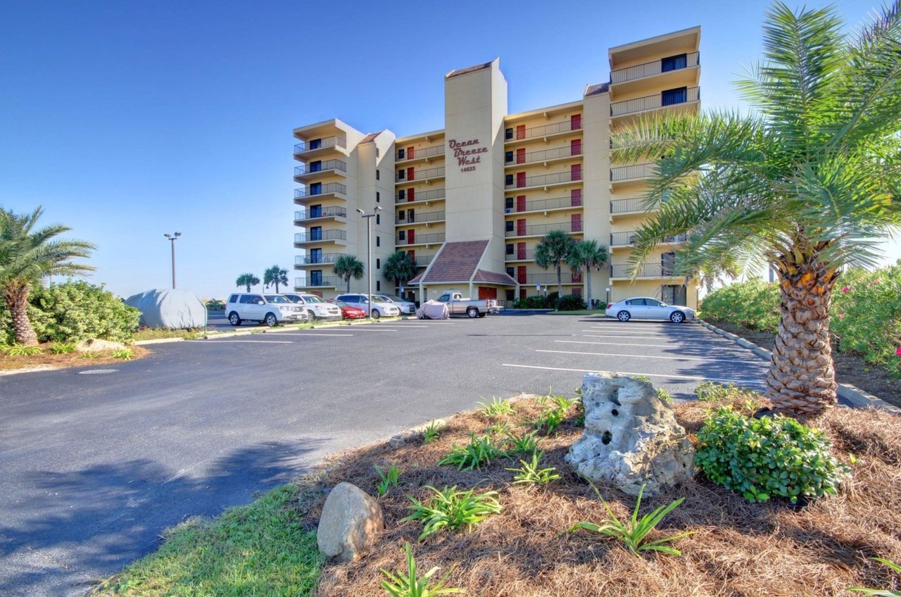 View from the street of Ocean Breeze West and the complimentary parking in front of the building