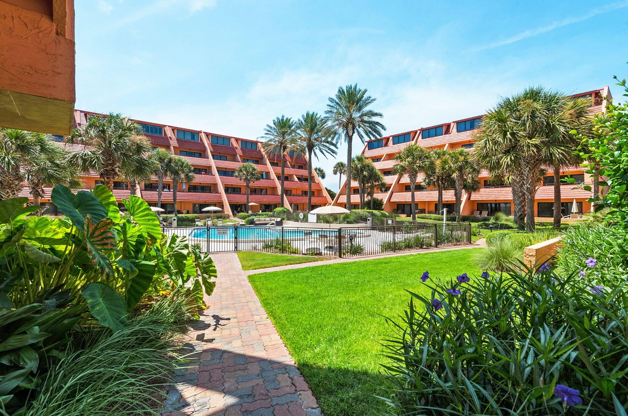 The complex features a refreshing aqua swimming pool surrounded by a spacious sundeck.