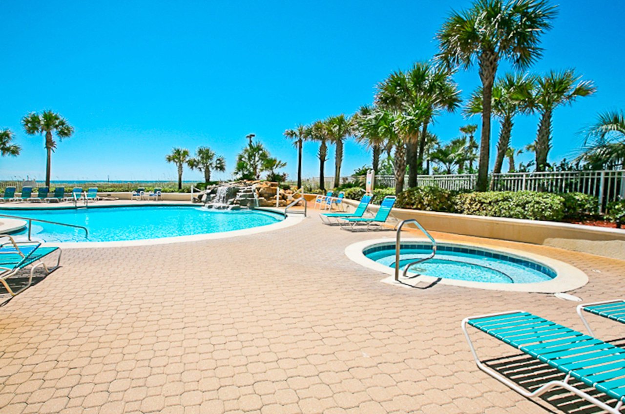 Community hot tub and pool with waterfall