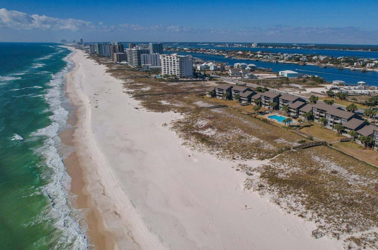 The long stretch of private beach in front of Needle Rush Point