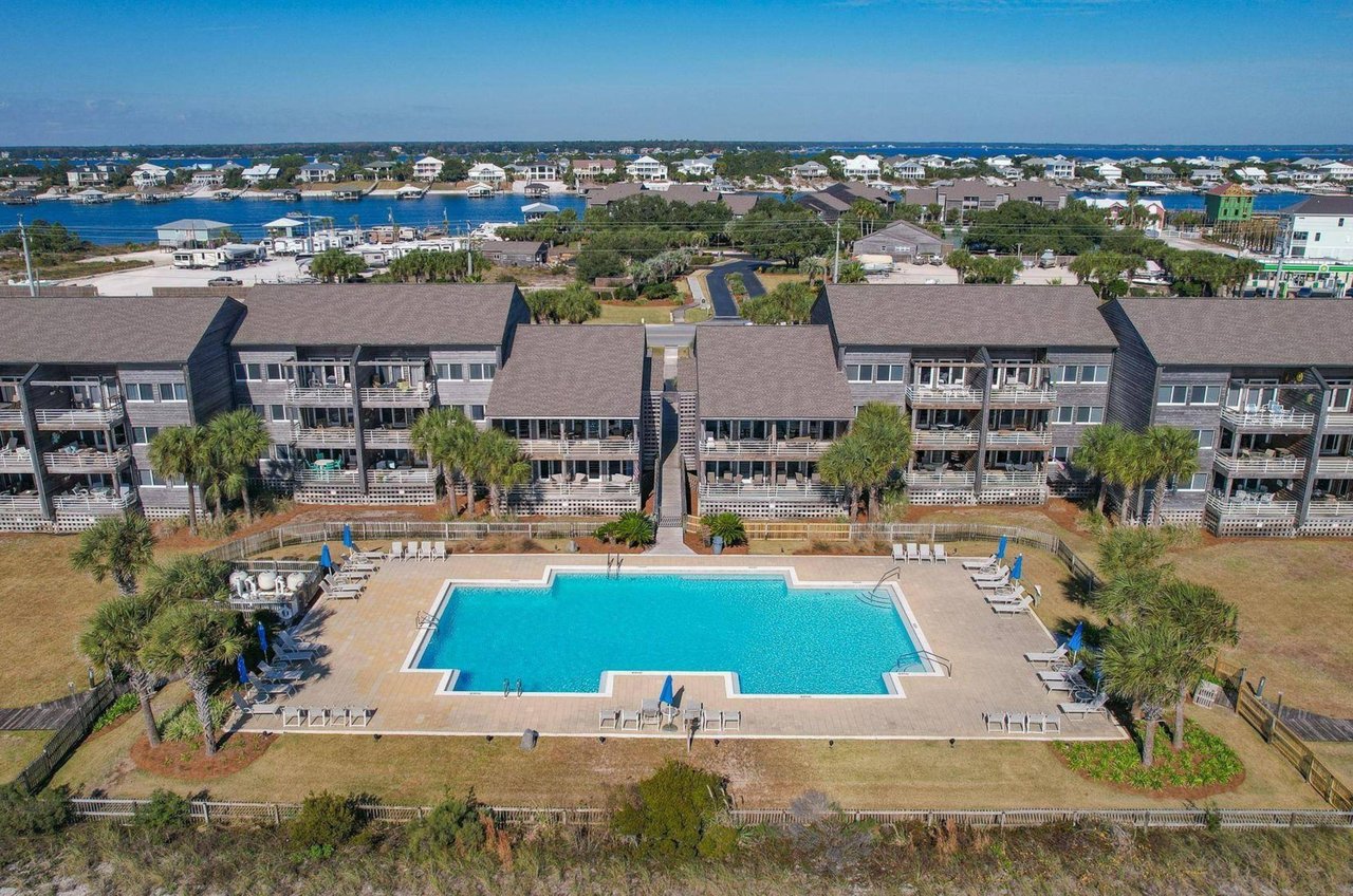 Aerial view of the swimming pool and condominiums at Needle Rush Point