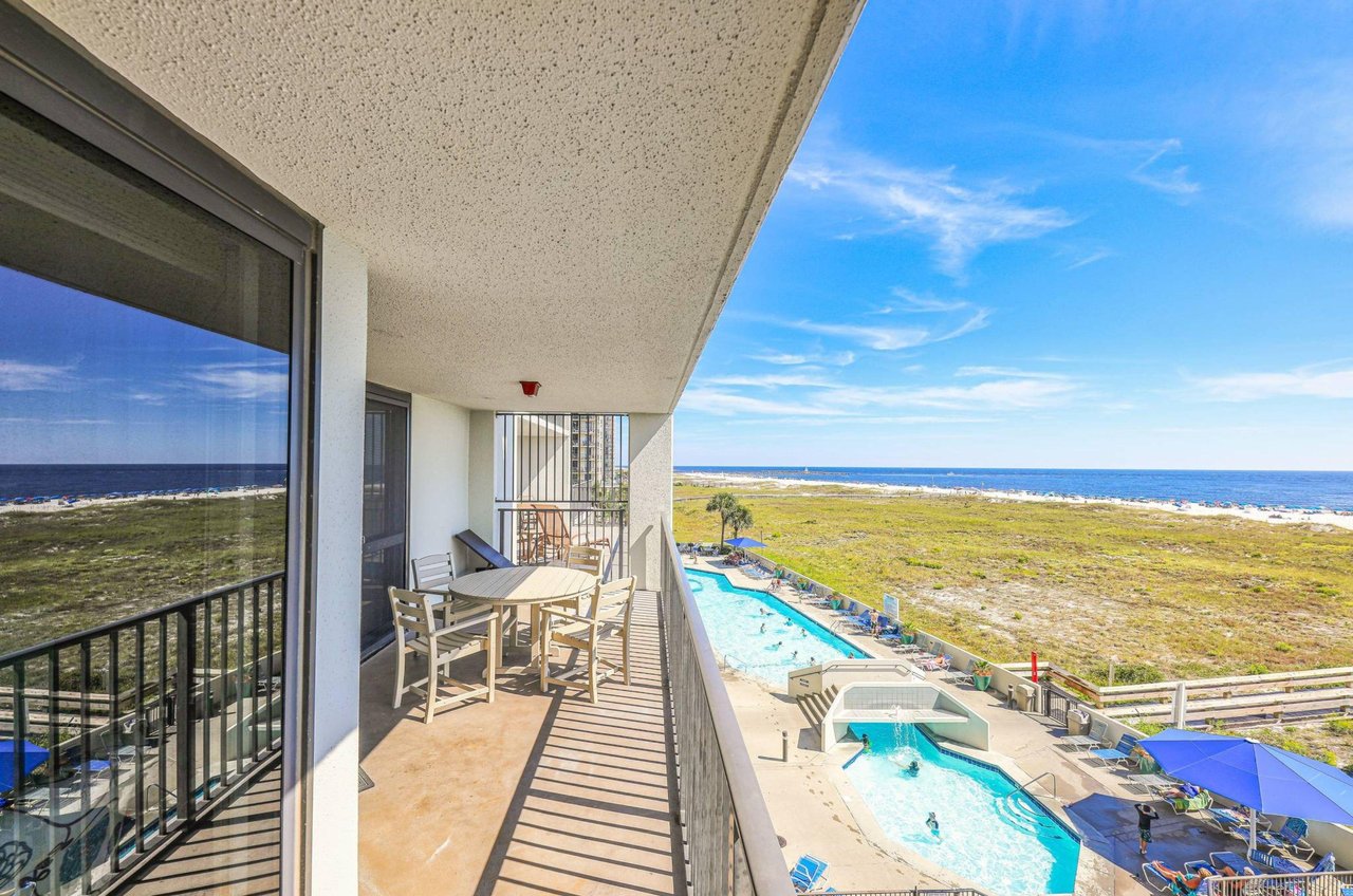 A private balcony overlooking the Gulf and the pool deck at Phoenix VI in Orange Beach Alabama