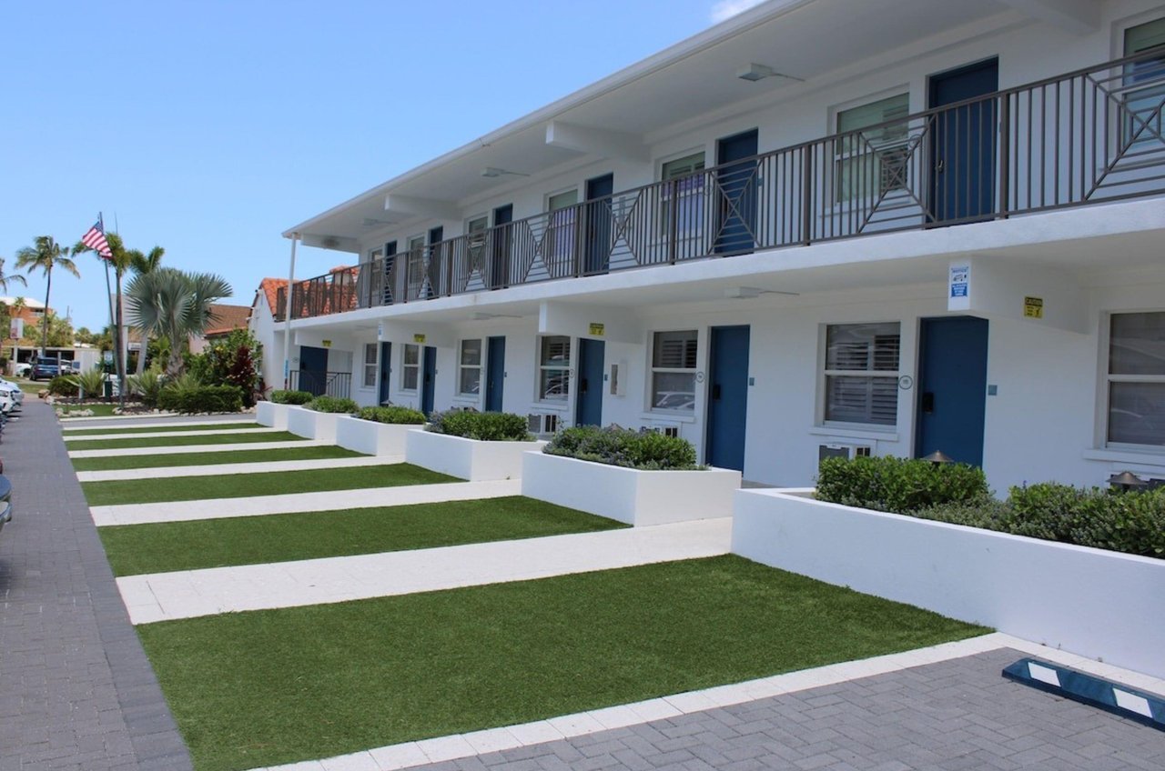 The streetside exterior of the rooms at Siesta Key Beach Resort and Suites in Siesta Key Florida