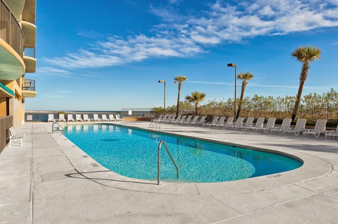 The outdoors swimming pool next to the beach at Grand Pointe in Orange Beach Alabama