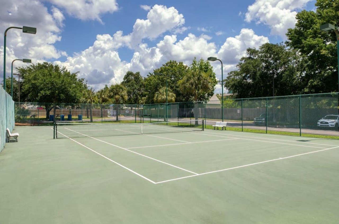 The outdoor tennis court at Harbor Cove in Orange Beach Alabama