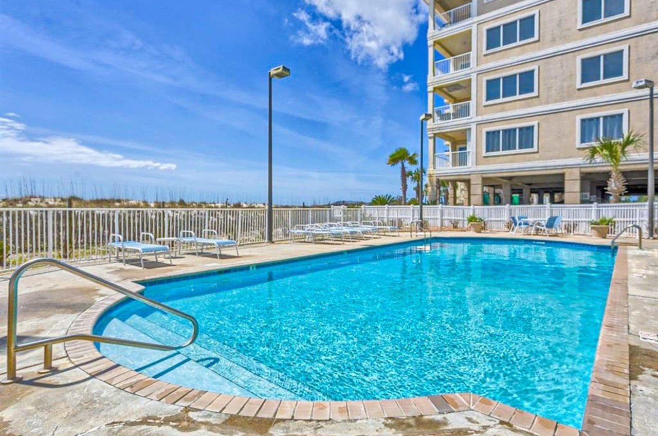 The crystal clear beachside swimming pool at Dolphin Key in Orange Beach Alabama