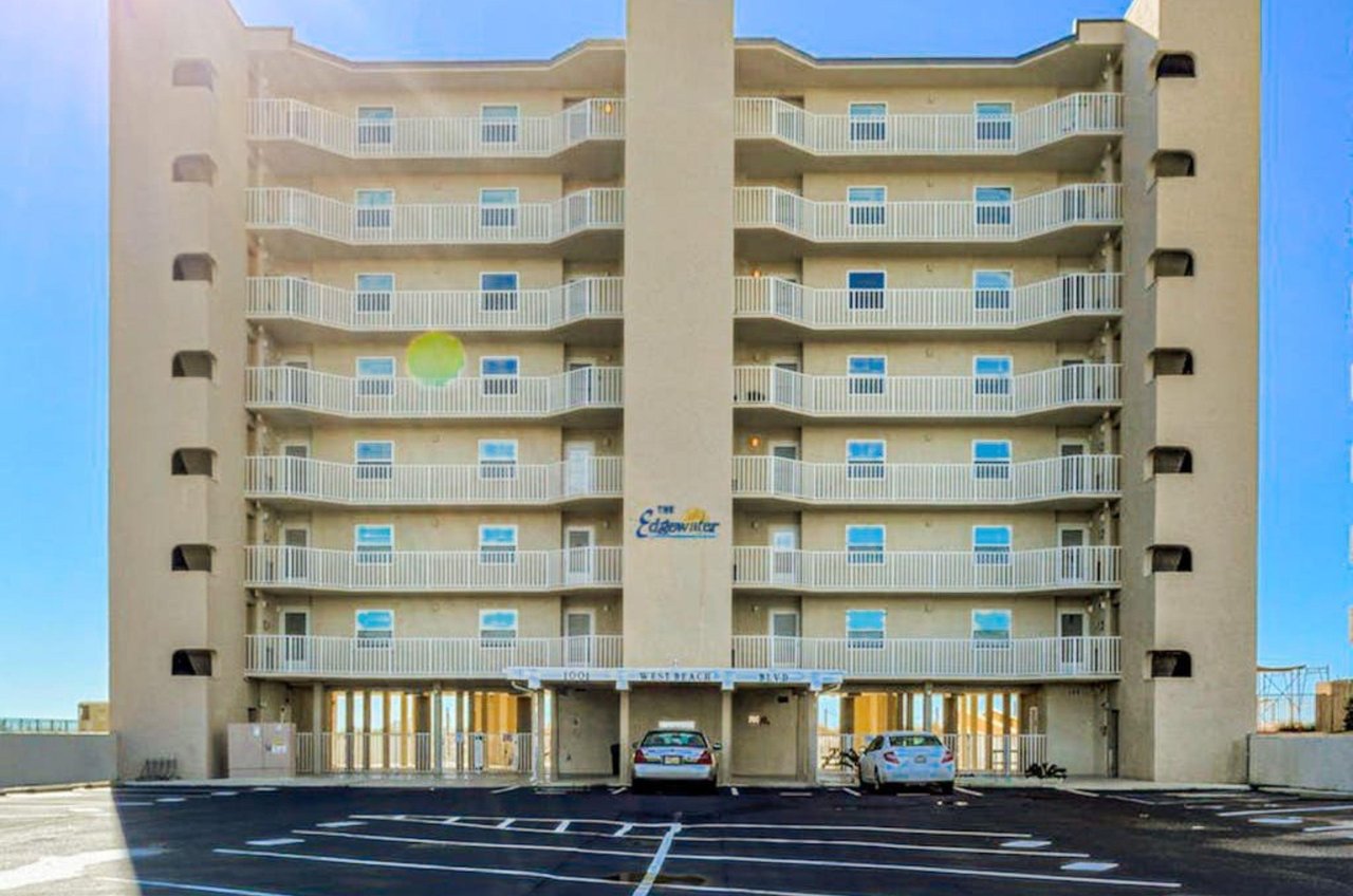 View from the street of Edgewater East with complimentary parking spots out front