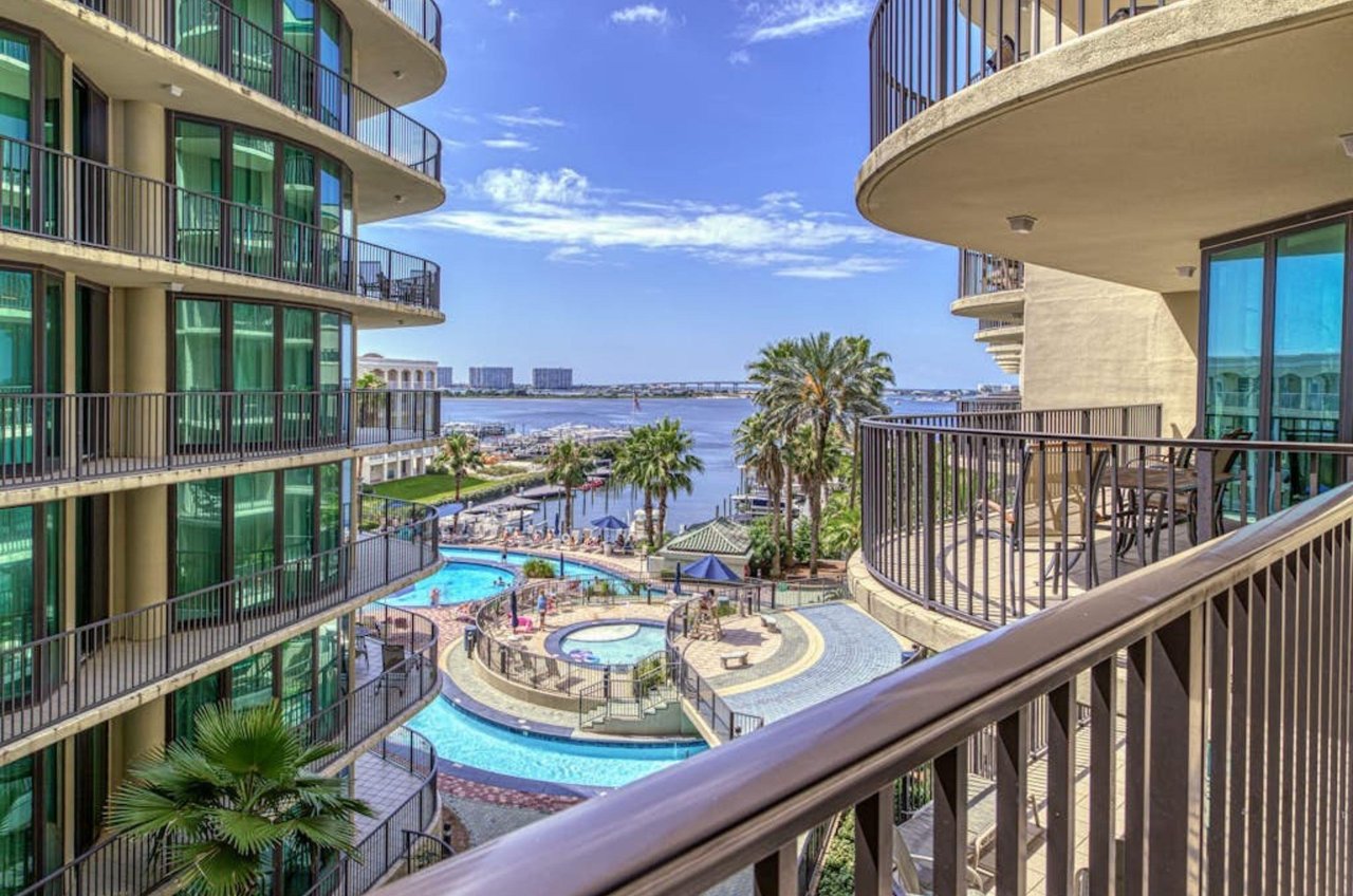 View of the pool area from a private balcony at Phoenix on the Bay in Orange Beach Alabama