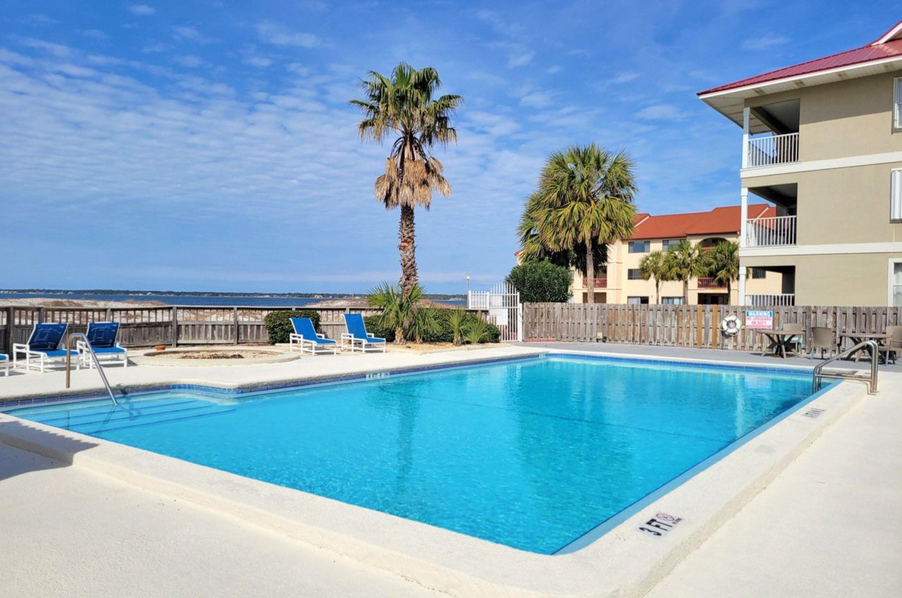 Lounge by the outdoor pool at Sunset Harbor Palms