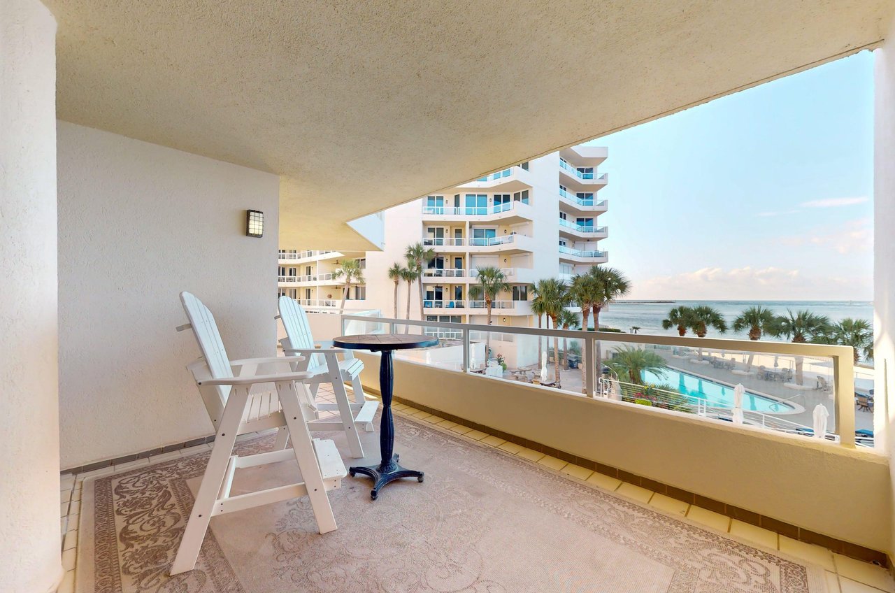 This balcony looks out over the swimming pool, Gulf, jetties, and East Pass leading to Destin Harbor and Choctawhatchee Bay.
