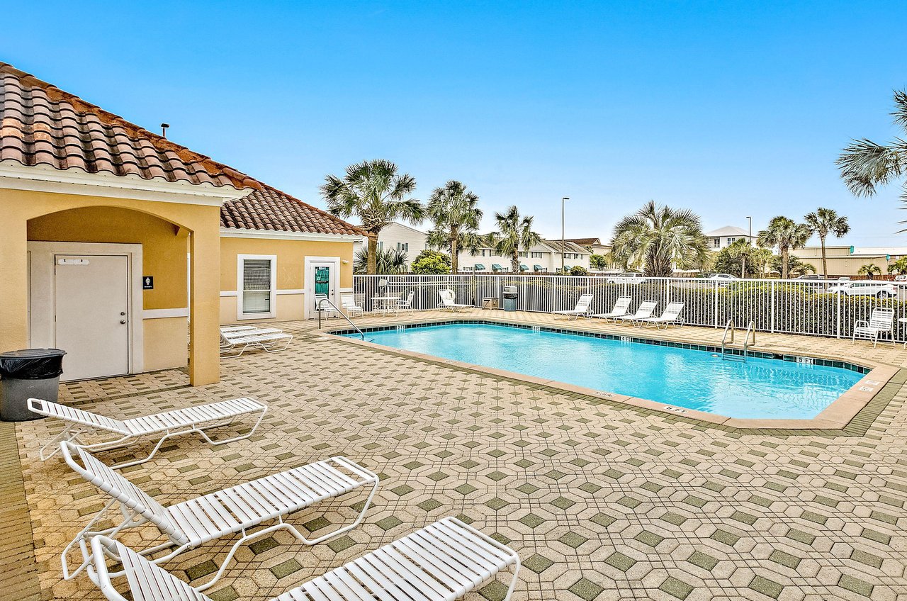 Ciboneys swimming pool, sundeck, and lounge chairs.