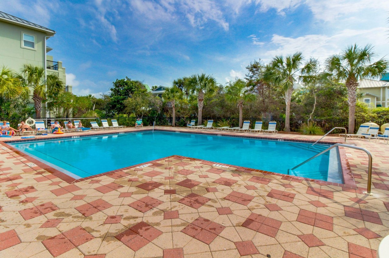 Guests sun by the community pool