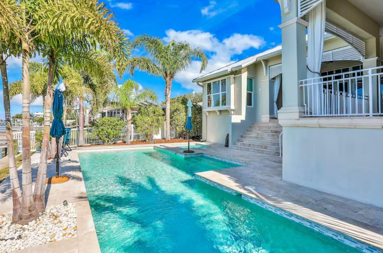 A gorgeous swimming pool beside a Clearwater vacation home.
