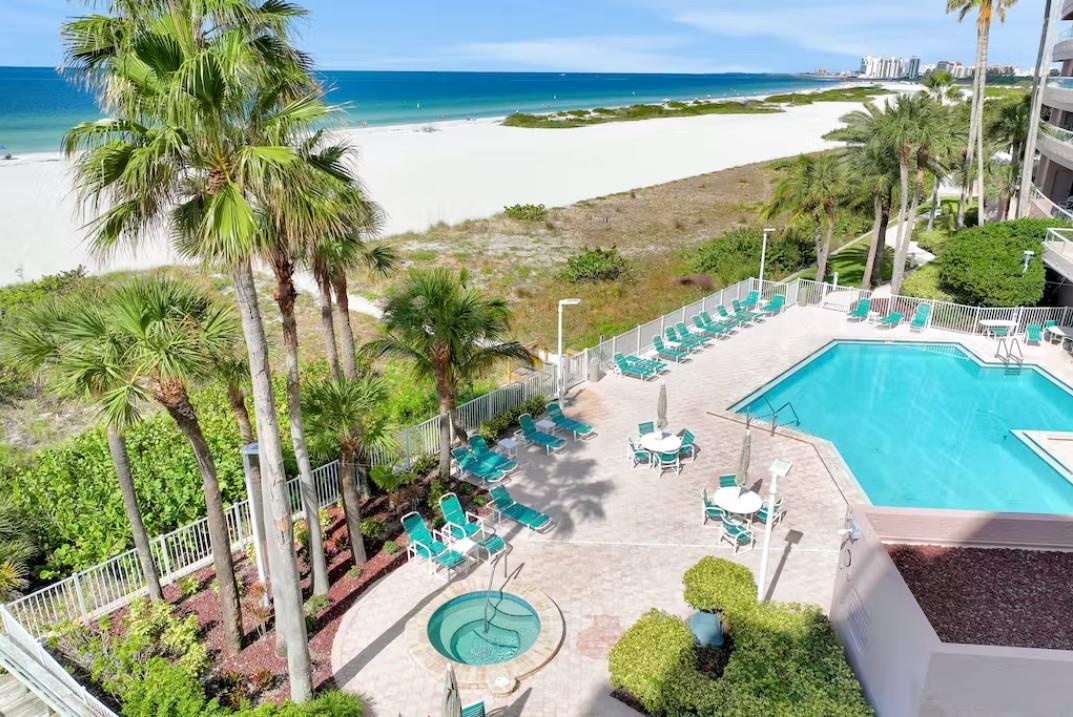 Crescent Beach Clubs beautiful swimming pool and sundeck sit next to one of Clearwaters beautiful beaches.