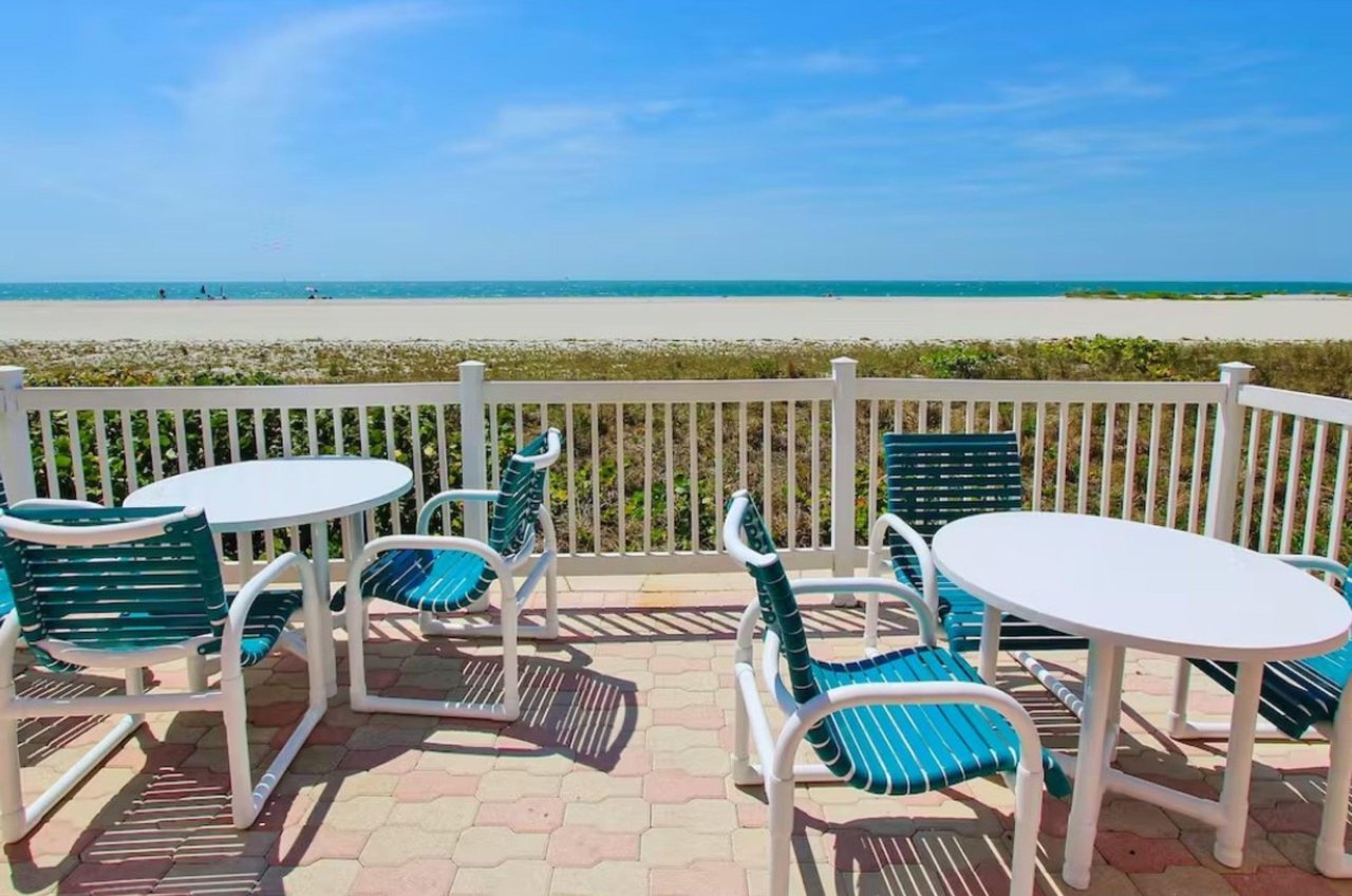 This Crescent Beach Clubs patio sits beside a beautiful Clearwater beach.