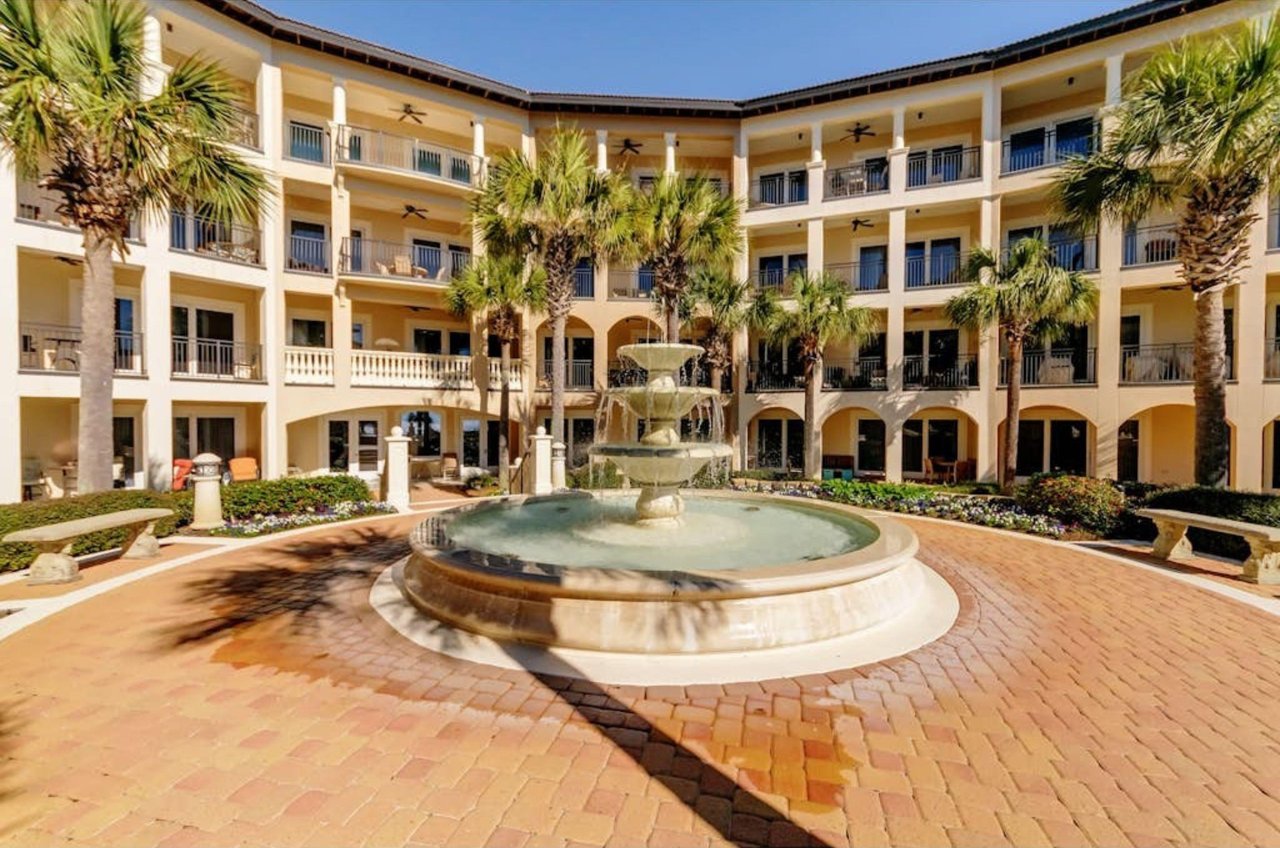 A large fountain in front of condominiums at Santa Rosa Beach Florida