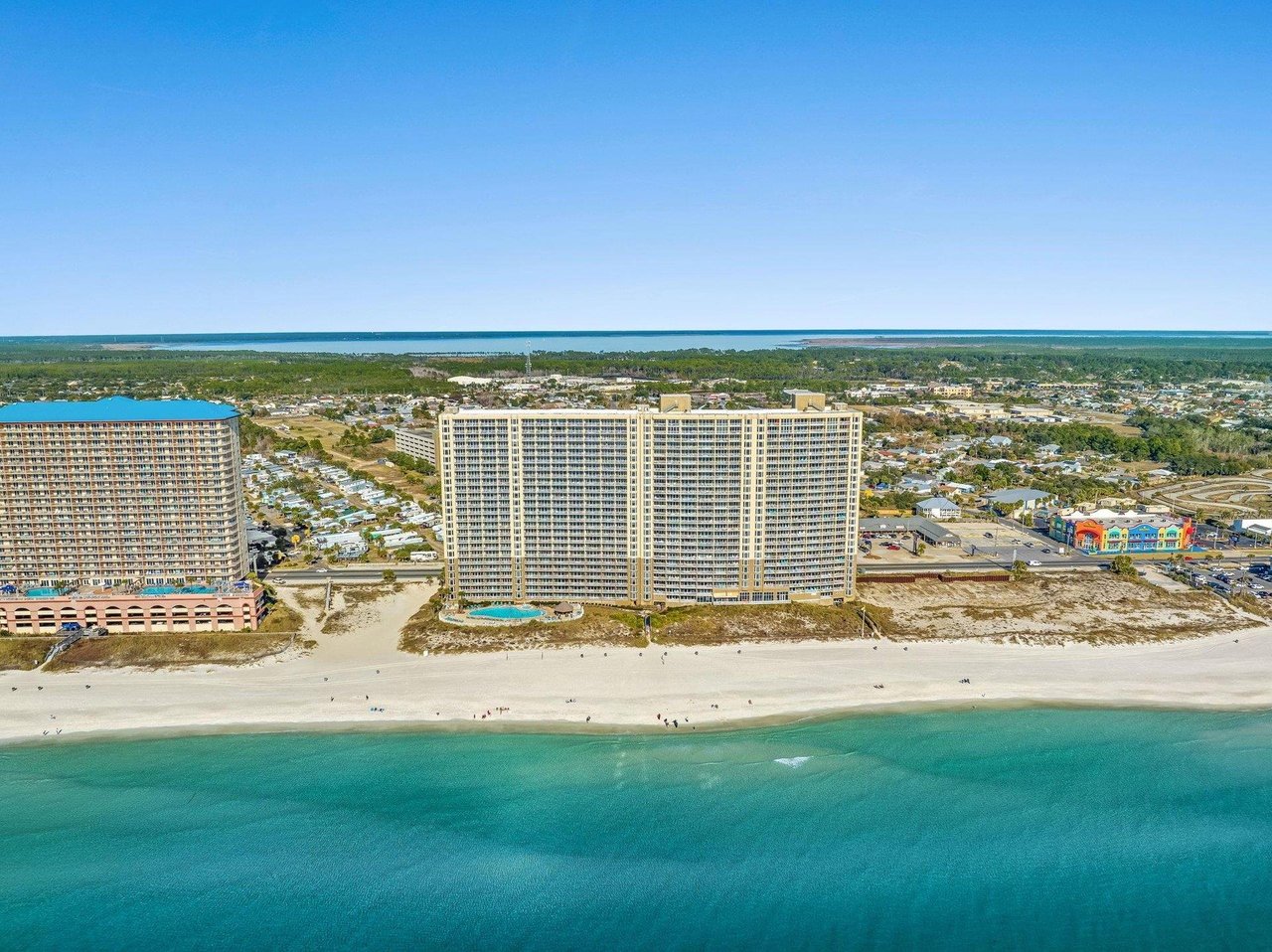 The outdoor swimming pool in front of Emerald Beach Resort in Panama City Beach Florida