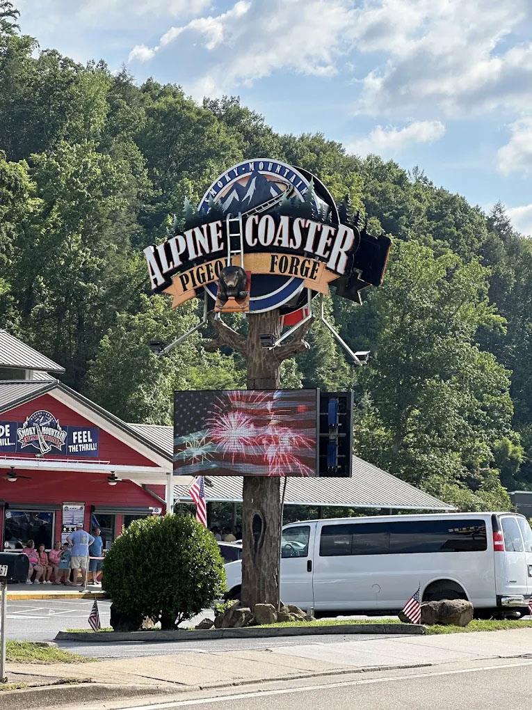 Brightly colored sign with the words Alpine Coaster