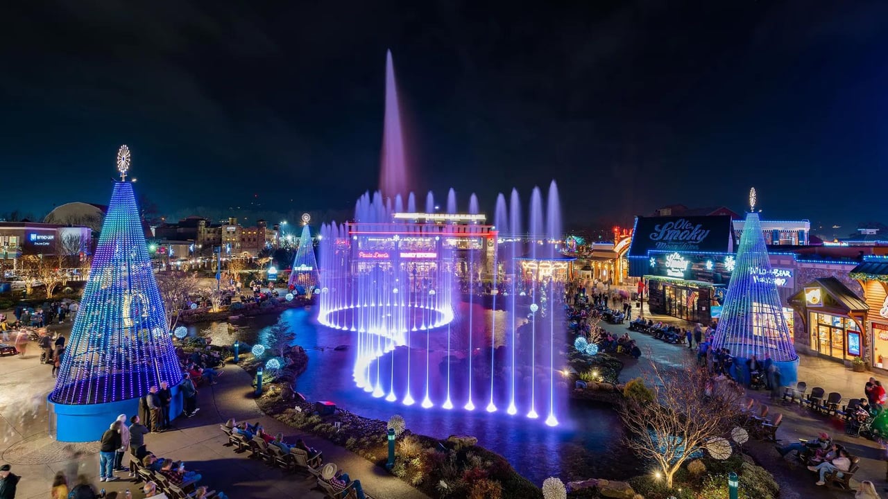 Water fountain with lights around it.