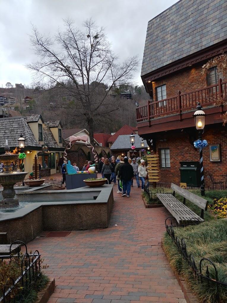 German style shops in wood and brick with a brick pathway.