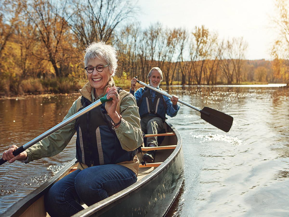 Couple in a boat on the water smiling