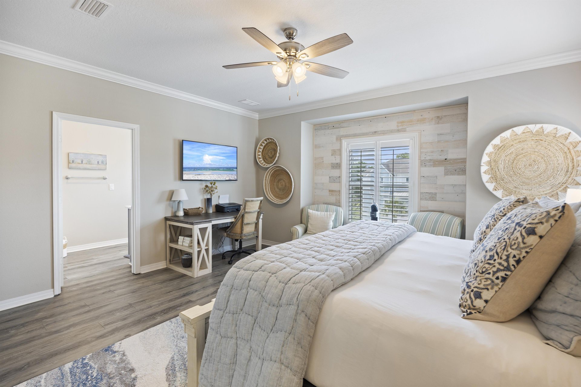 Primary bedroom is en suite to a large bathroom with walk in shower.