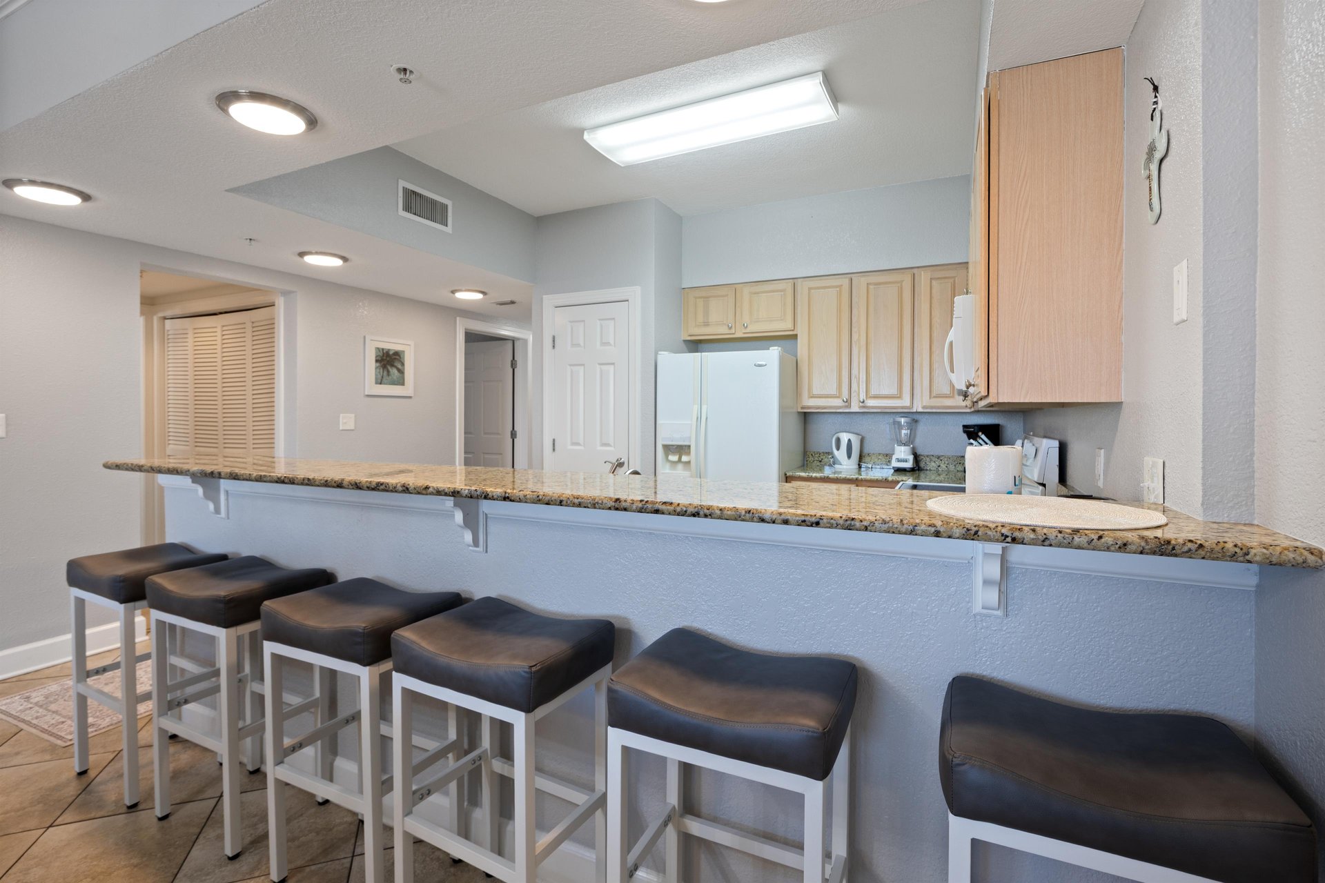 Plenty of seating for everyone with barstools and the dining room table.