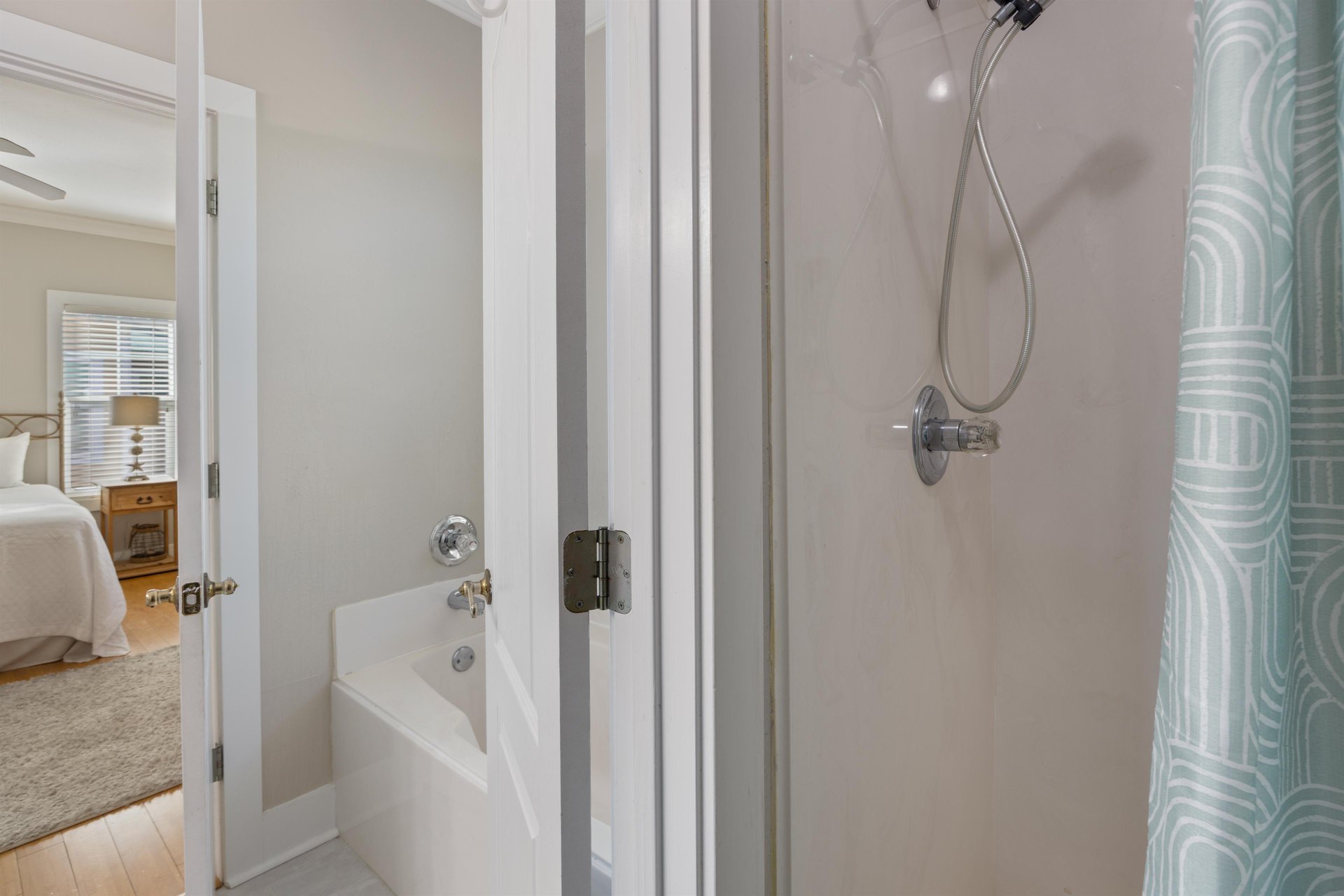 Primary bath is en suite with a separate shower and a soaking tub.