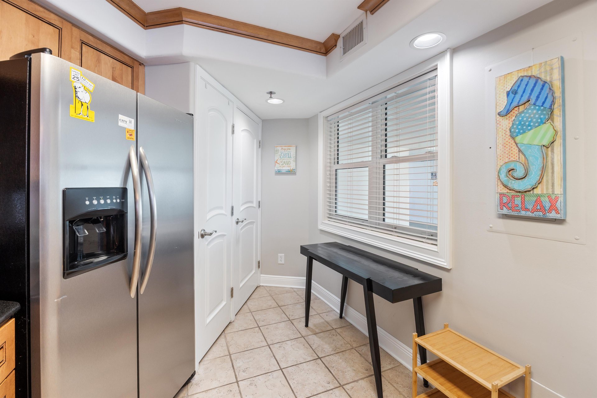 Fully equipped kitchen with washer  dryer closet.