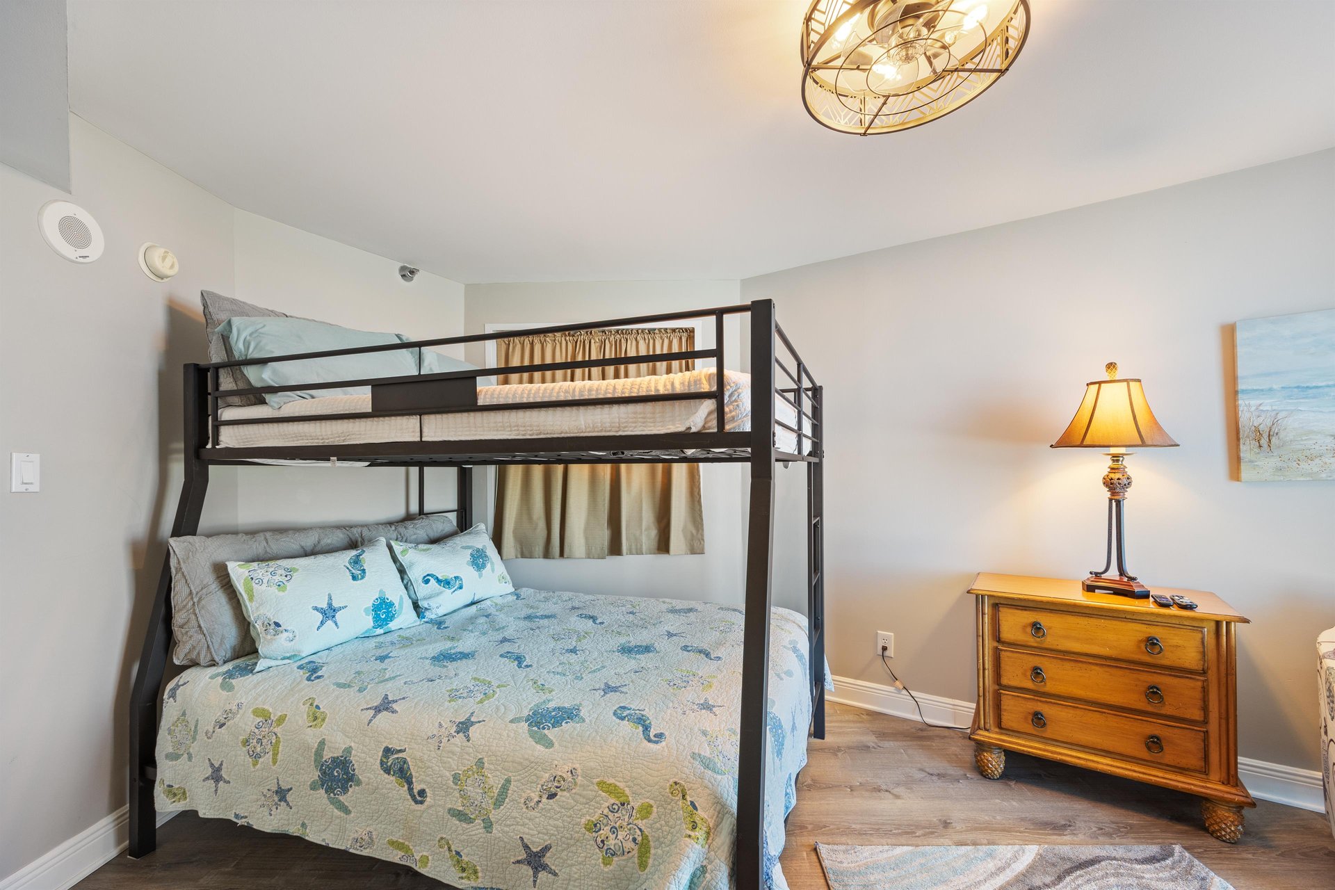 Guest bedroom with full over queen bunk bed.