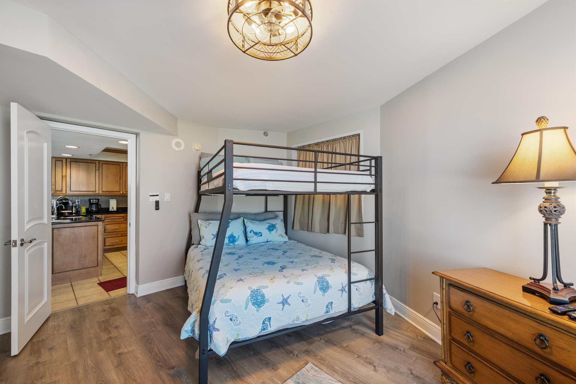 Guest bedroom with full over queen bunk bed.