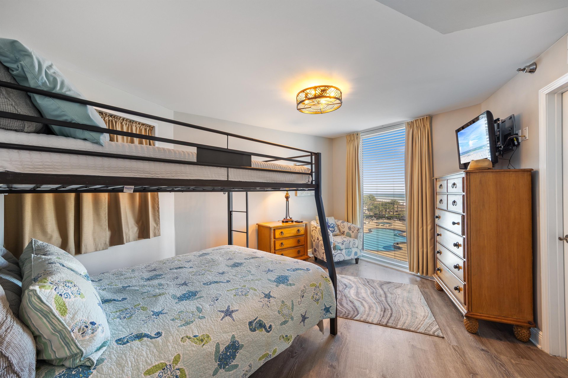 Guest bedroom with full over queen bunk bed.