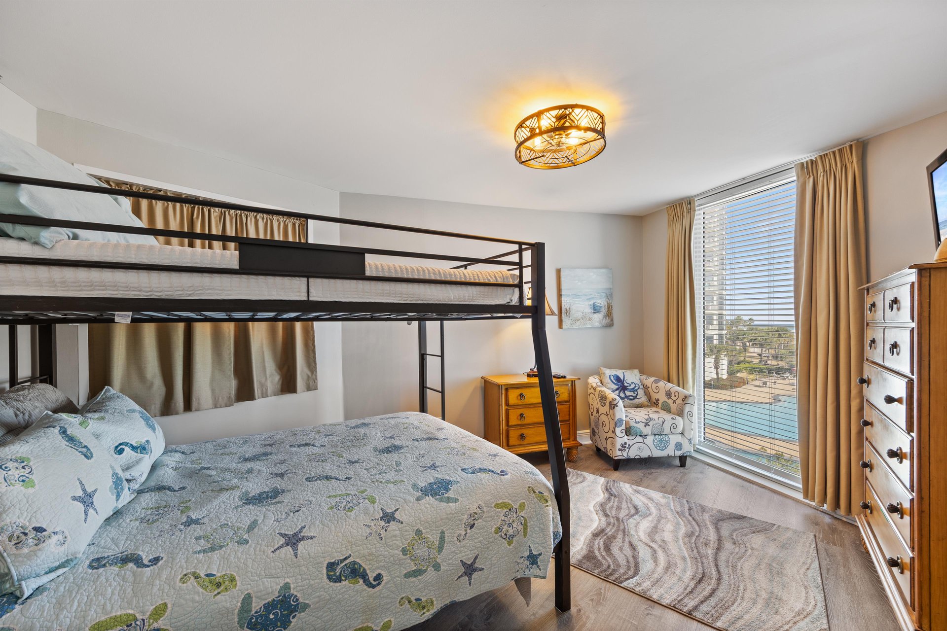 Guest bedroom with full over queen bunk bed.