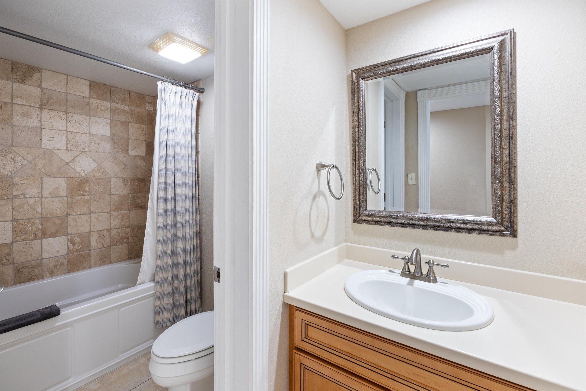 Primary bath with convenient tub shower combo.