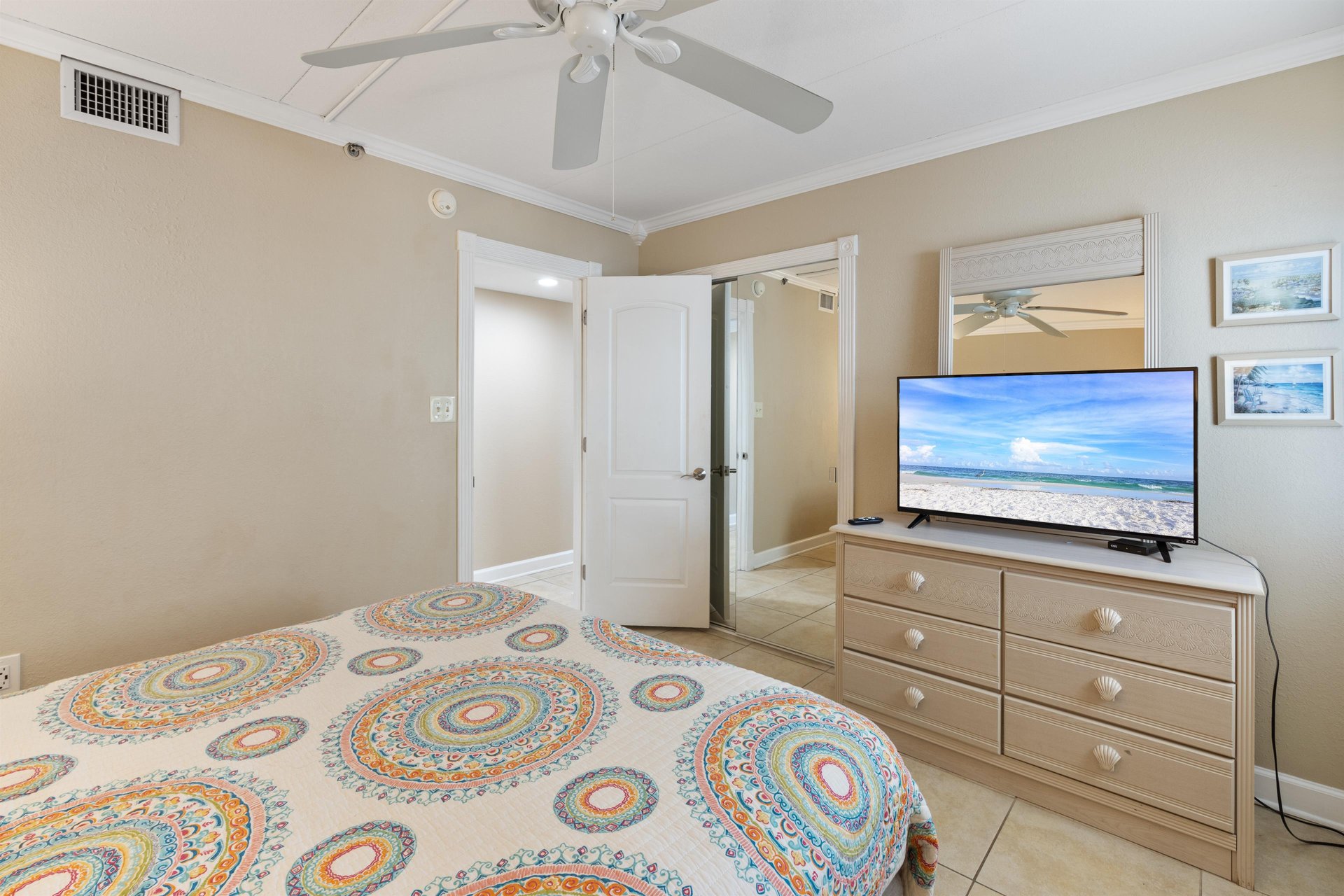Guest Bedroom 1 offers a Queen sized bed.