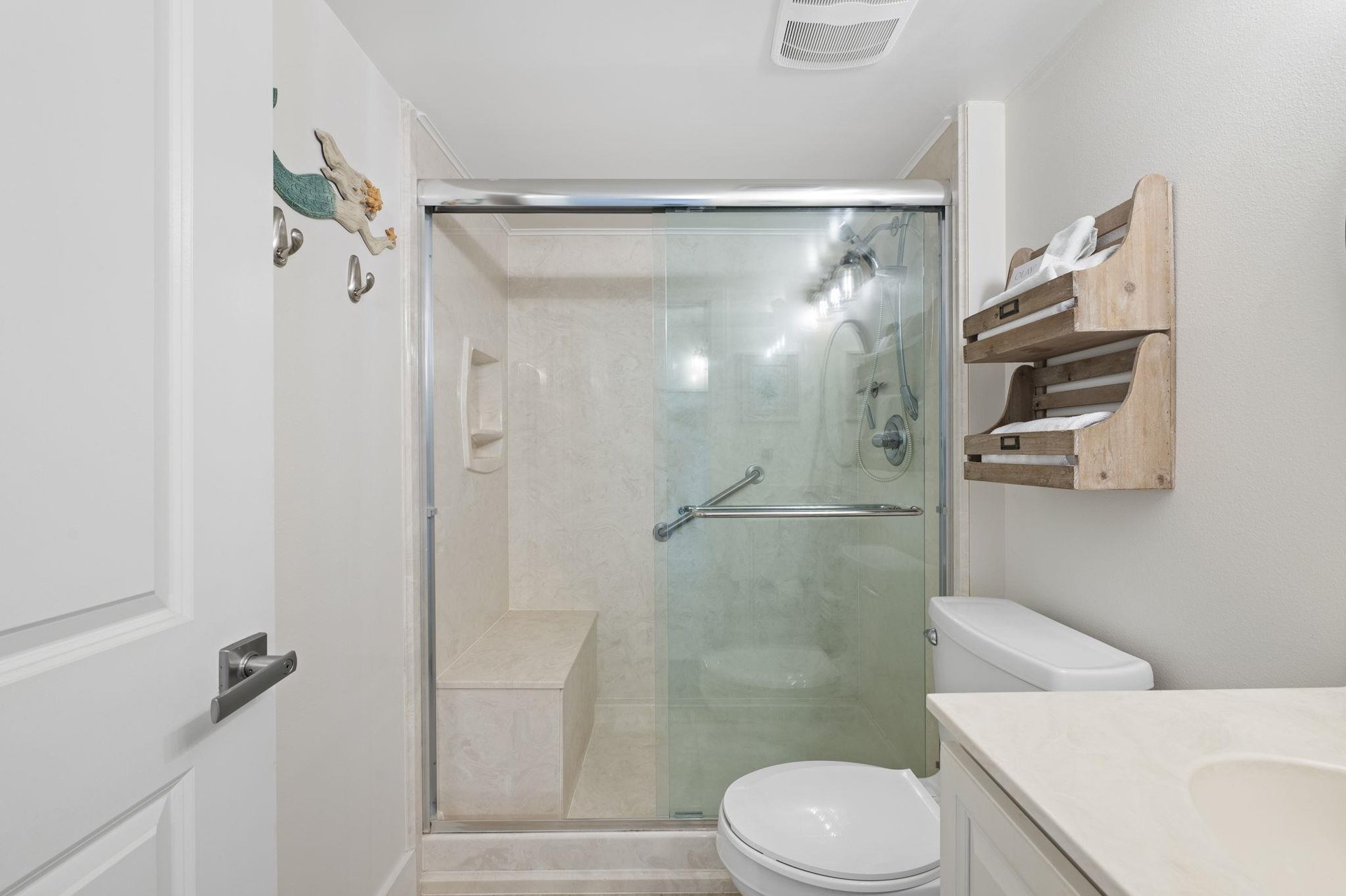 Walk in shower with shower bench and hand rails