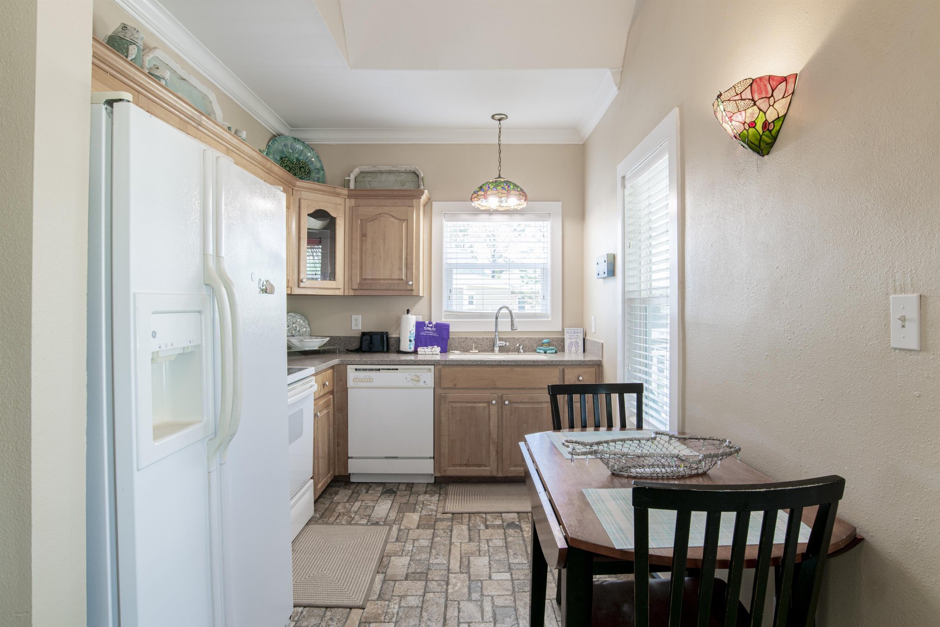 Cute kitchen is fully equipped with everything you need.