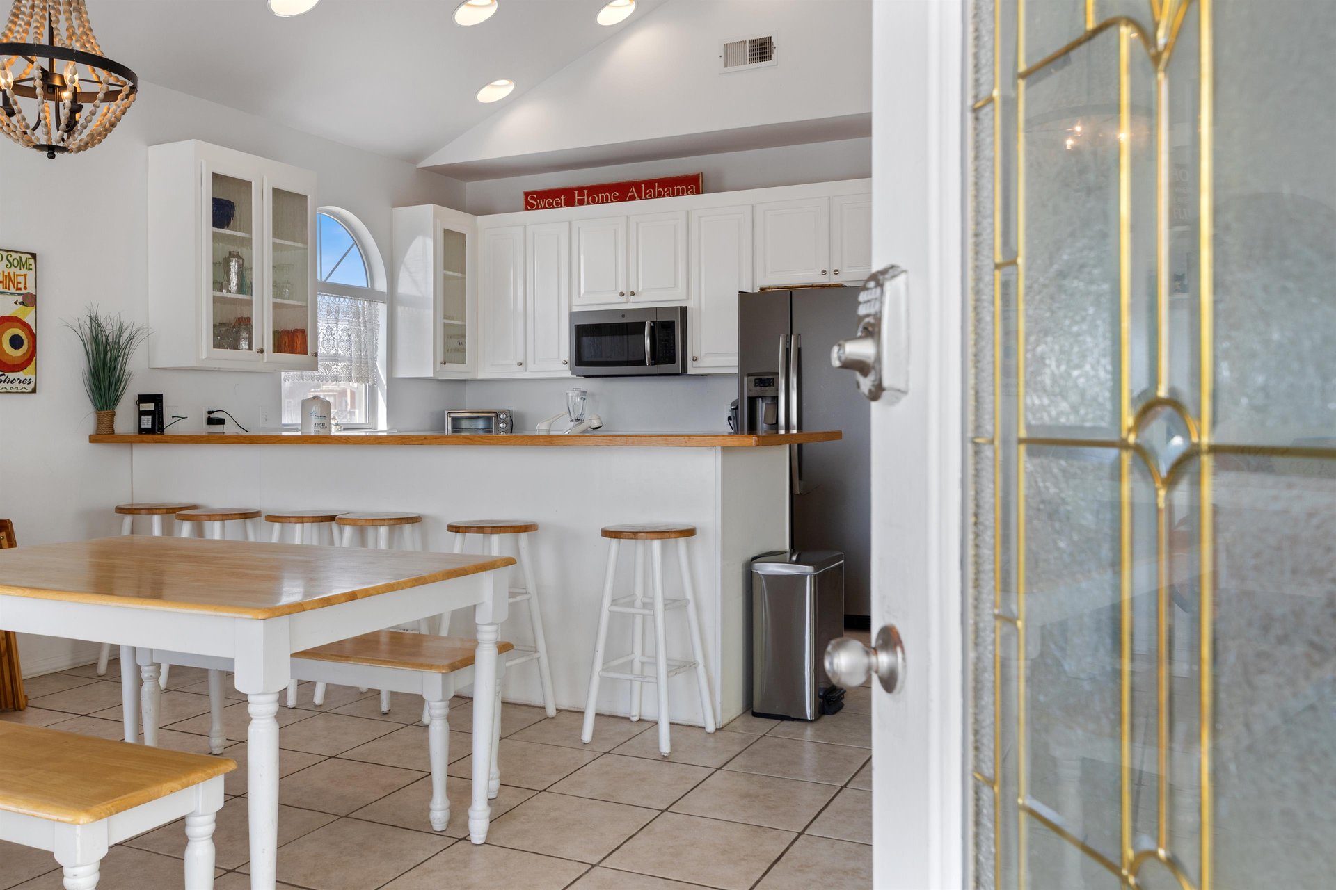 Bright, fully equipped kitchen with dining space—perfect for easy meals and gathering together
