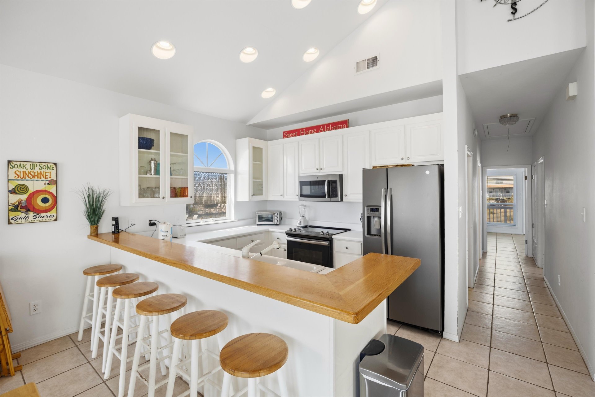 Wellstocked kitchen with modern appliances and plenty of counter space for cooking at home