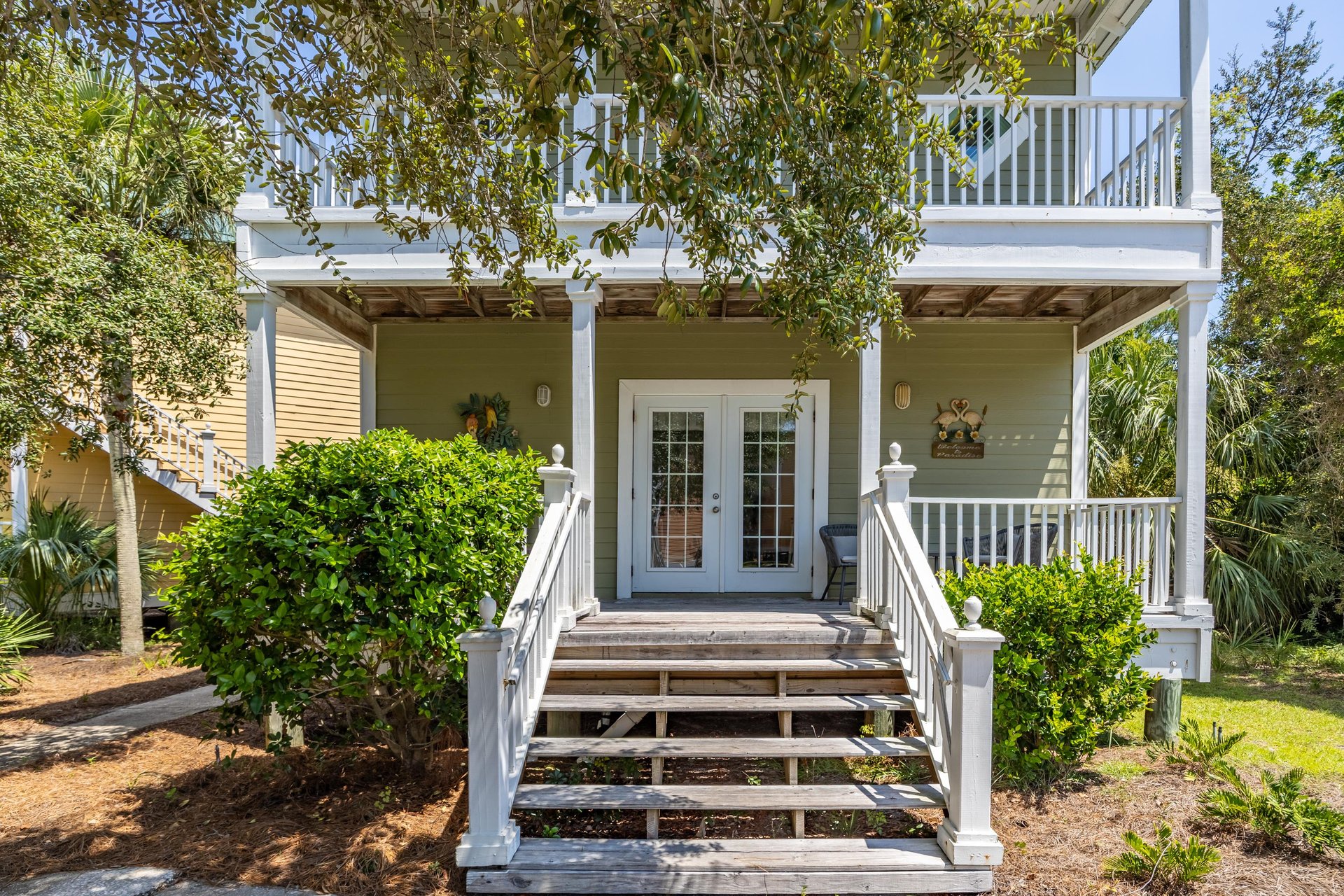 This is The Tiki Hideout—our villa tucked inside the gated Purple Parrot Resort, just minutes from the beaches of Perdido Key