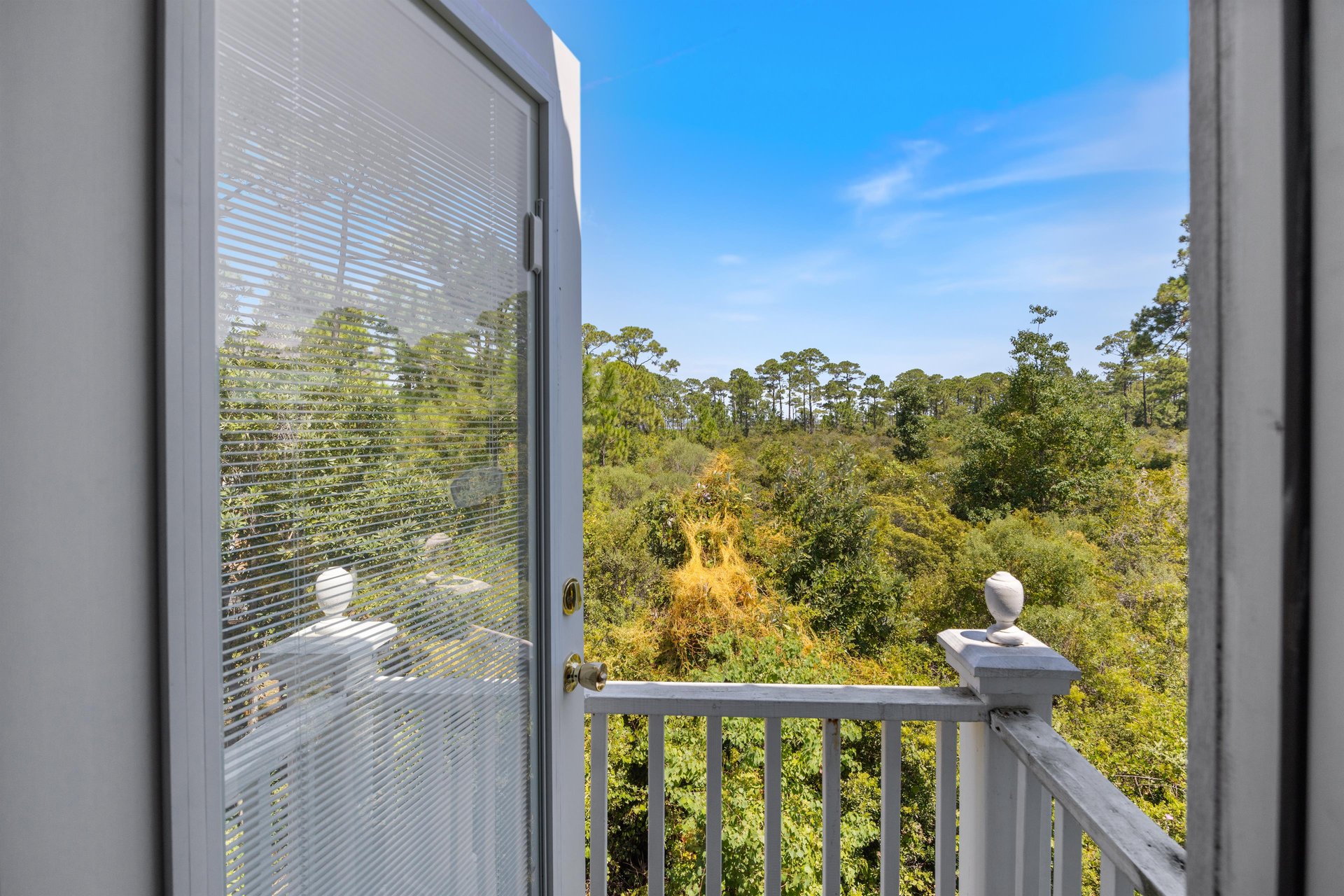 Private veranda off the guest room overlooking a peaceful greenbelt with views toward the intracoastal waterway in the distance
Weve always loved how quiet and relaxing this side of the property feel